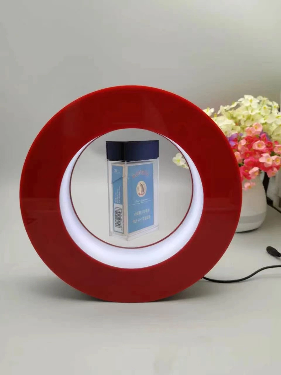 Custom Red Color Acrylic Magnetic Levitation Desk Floating Cigarette Cosmetics Watch Can Display Stand for Advertisement with LED Light 360 Rotating